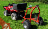 trailer behind small tractor on wood